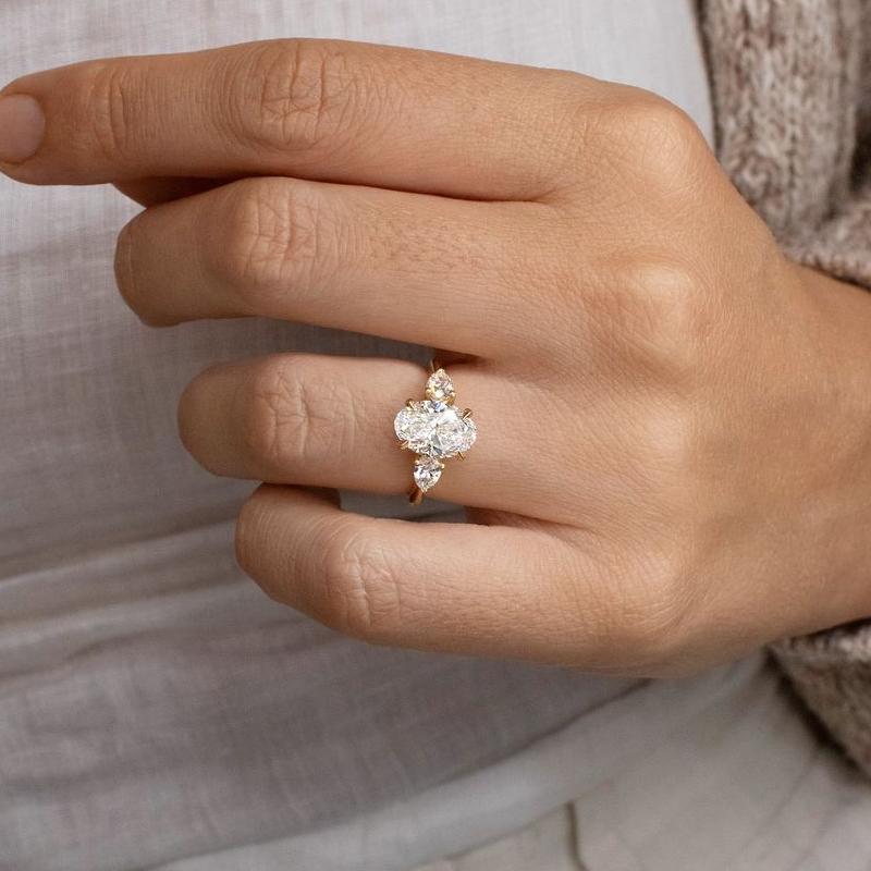 Noble Oval Cut Three Stone Engagement Ring